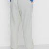 Pantalon de survêtement beige à rayures latérales Ralph Lauren pour femme Pantalon de survêtement beige à rayures latérales Ralph Lauren pour femme