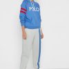 Pantalon de survêtement beige à rayures latérales Ralph Lauren pour femme Pantalon de survêtement beige à rayures latérales Ralph Lauren pour femme