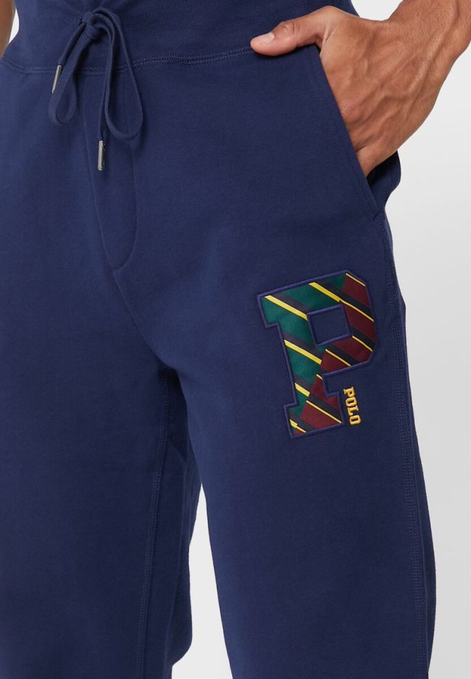 Pantalon de survêtement bleu marine Ralph Lauren pour homme avec cordon de serrage et revers Pantalon de survêtement bleu marine Ralph Lauren pour homme avec cordon de serrage et revers