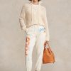 Pantalon de survêtement en molleton crème pour femme Ralph Lauren avec logo et motif vague Pantalon de survêtement en molleton crème pour femme Ralph Lauren avec logo et motif vague