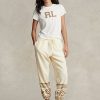 Pantalon de survêtement en molleton à motif flocon de neige Ralph Lauren crème pour femme Pantalon de survêtement en molleton à motif flocon de neige Ralph Lauren crème pour femme