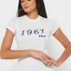 T-shirts blancs à col rond et imprimé graphique Ralph Lauren pour femmes T-shirts blancs à col rond et imprimé graphique Ralph Lauren pour femmes